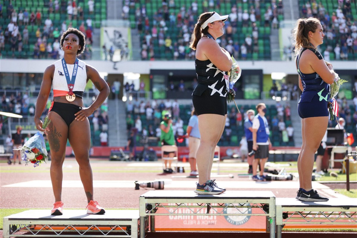 <i>Patrick Smith/Getty Images</i><br/>Gwendolyn Berry (left) stands on the podium having placed third in the hammer throw final at the US Olympic trials.