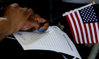 The Biden administration is introducing an unprecedented effort to encourage eligible immigrants to apply for US citizenship. An immigrant is seen during a naturalization ceremony in Los Angeles on Thursday