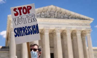 Activists rally outside the Supreme Court on June 23 in Washington