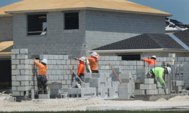 Construction workers build a home on April 16 in Miami