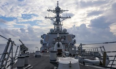 The guided-missile destroyer USS Benfold steams through the South China Sea on Monday