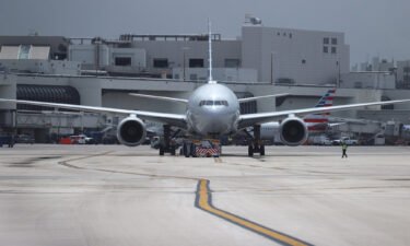 An American Airlines plane is prepared for takeoff at the Miami International Airport on June 16 in Miami
