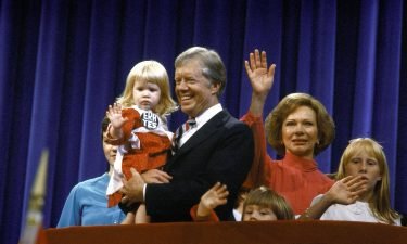 Then-President Jimmy Carter holding his granddaughter Sarah