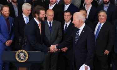 Los Angeles Dodgers pitcher Clayton Kershaw shakes hands with President Joe Biden during a celebration of the team's 2020 World Series championship on July 02