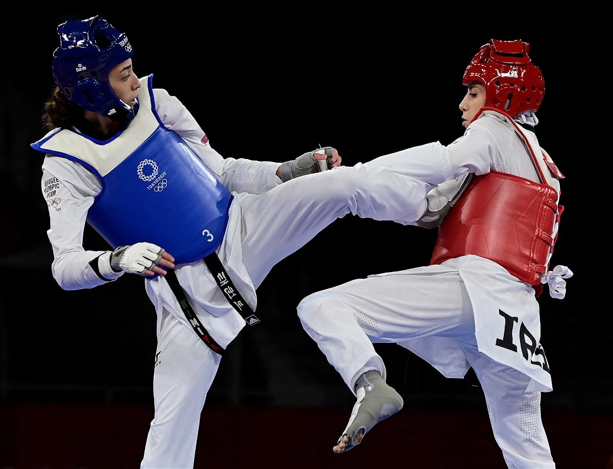 <i>Javier Soriano/AFP/Getty Images</i><br/>Refugee Olympic Team's Kimia Alizadeh (Blue) and Iran's Nahid Kiyani Chandeh (Red) compete in the taekwondo women's -57kg elimination round bout during the Tokyo 2020 Olympic Games at the Makuhari Messe Hall in Tokyo on July 25.