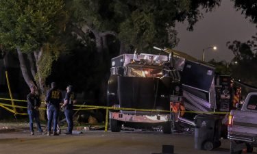 The remains of an armored Los Angeles Police Department tractor-trailer are seen after fireworks exploded Wednesday evening