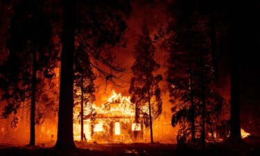 A home burns as flames from the Dixie fire tear through the Indian Falls neighborhood on July 24.