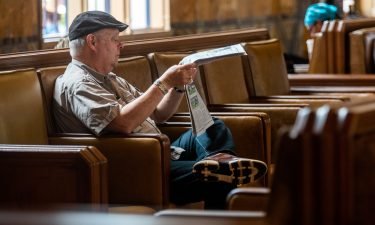 A new book argues that chasing subscription dollars is bad for journalism. A man reads a newspaper inside Union Station on June 29