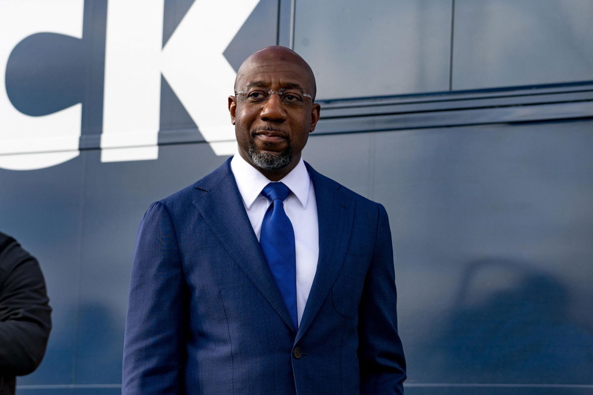 <i>Megan Varner/Getty Images</i><br/>Georgia Democratic Candidate Rev. Raphael Warnock meets with supporters on January 5 in Marietta