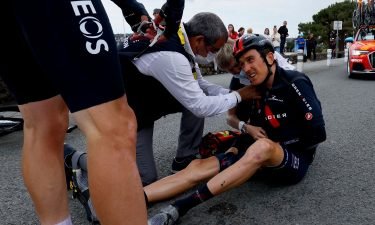 Geraint Thomas sits on the road after crashing during the third stage of the 108th edition of the Tour de France cycling race