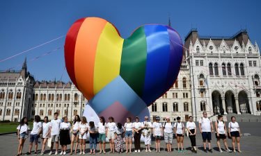 Activists protesting against what they say is an anti-LGBT law gather in front of a rainbow balloon at Hungary's parliament in Budapest on Thursday.