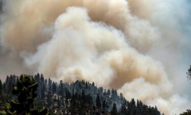 Smoke rises from the Dixie Fire burning along Highway 70 in Plumas National Forest on July 16. PG&E announced July 21 that it will bury 10