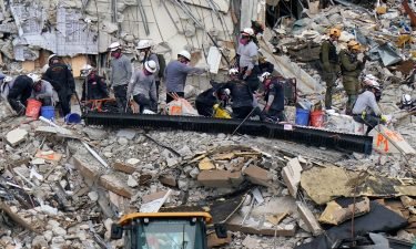 Rescue workers search in the rubble at the Champlain Towers South condominium on June 30 in the Surfside area of Miami.