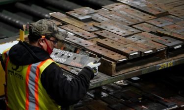 A worker gathers parts during production at the SME Steel Contractors facility in West Jordan