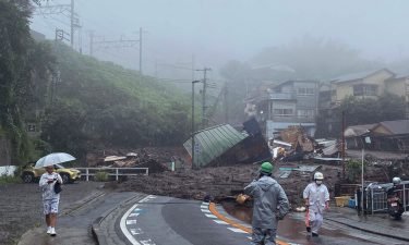 A road is covered by mud and debris following heavy rain in Atami city