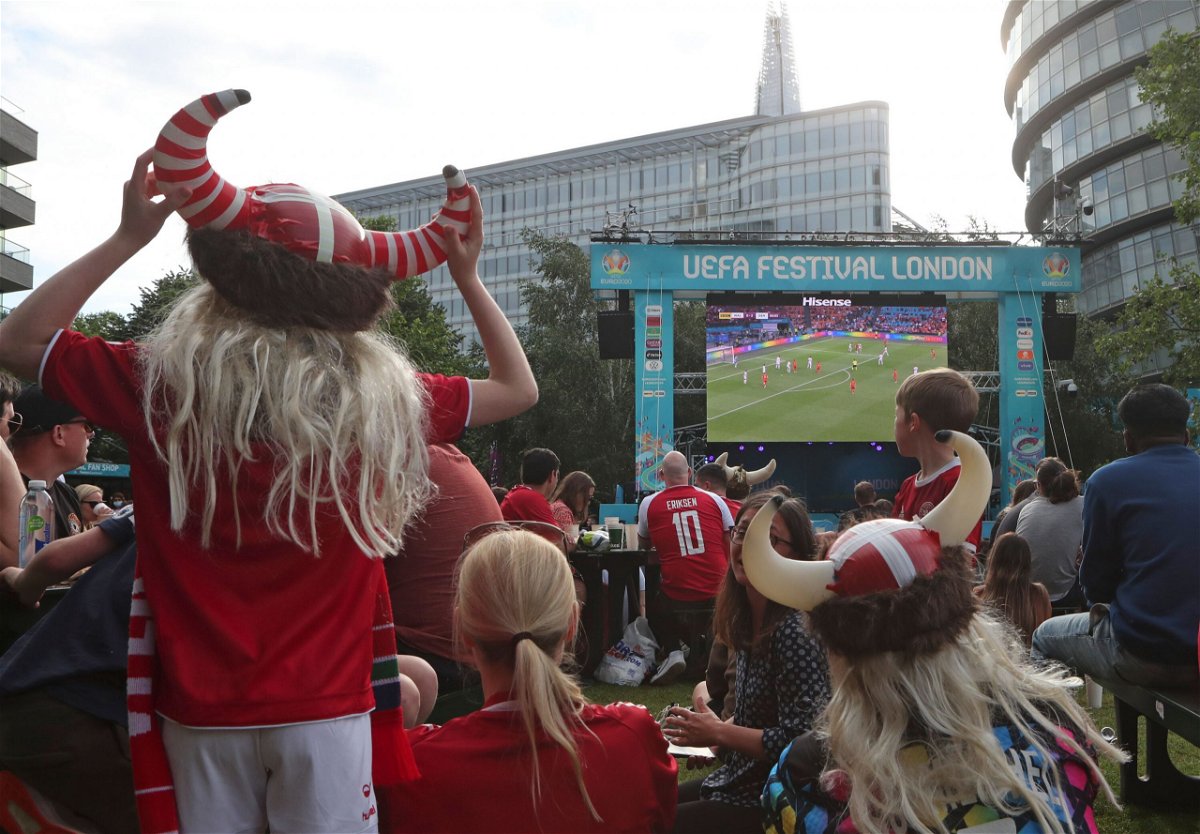 <i>Tony Hicks/AP</i><br/>Danish supporters react at a fan area in Potters Field in London.