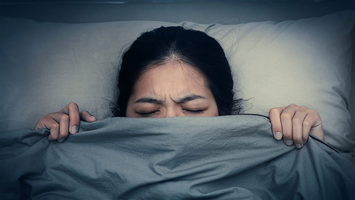 <i>Shutterstock</i><br/>A woman is shown unable to fall as sleep. Many of us experienced vivid