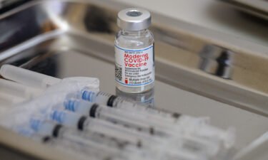 A vial of the Moderna Covid-19 vaccine and syringes sit prepared at a pop up vaccine clinic at the Jewish Community Center on April 16 in the Staten Island borough of New York City. Moderna is getting the ultimate Wall Street validation: It's being added to the S&P 500 index.