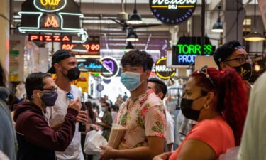 Visitors to the Grand Central Market are mostly masked on July 27