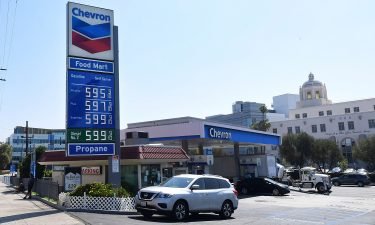 Some of the highest gas prices in town are posted on a signboard at a gas station in downtown Los Angeles