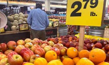 Customers shop for produce at a supermarket on June 10 in Chicago