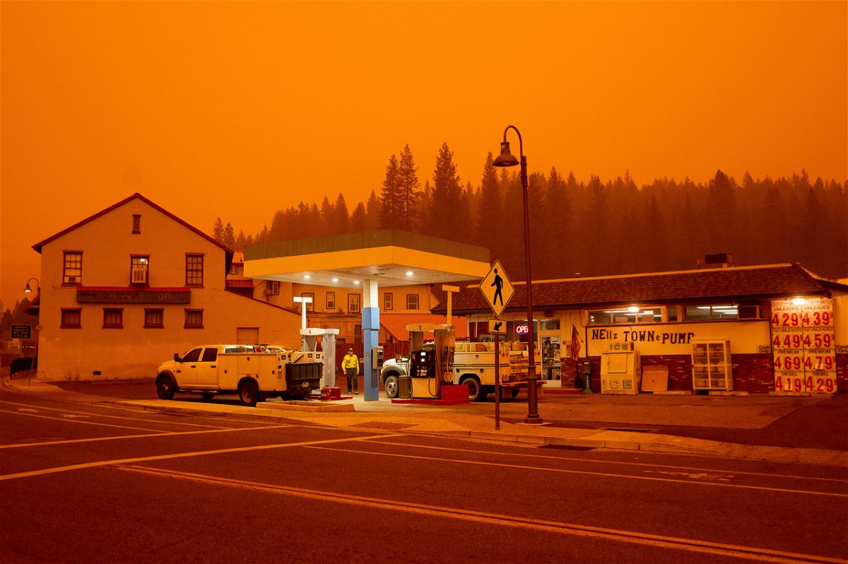 <i>Noah Berger/AP</i><br/>Firefighters gas up while battling the Dixie Fire in the Greenville community of Plumas County