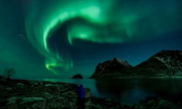 A person watches the northern lights on March 9