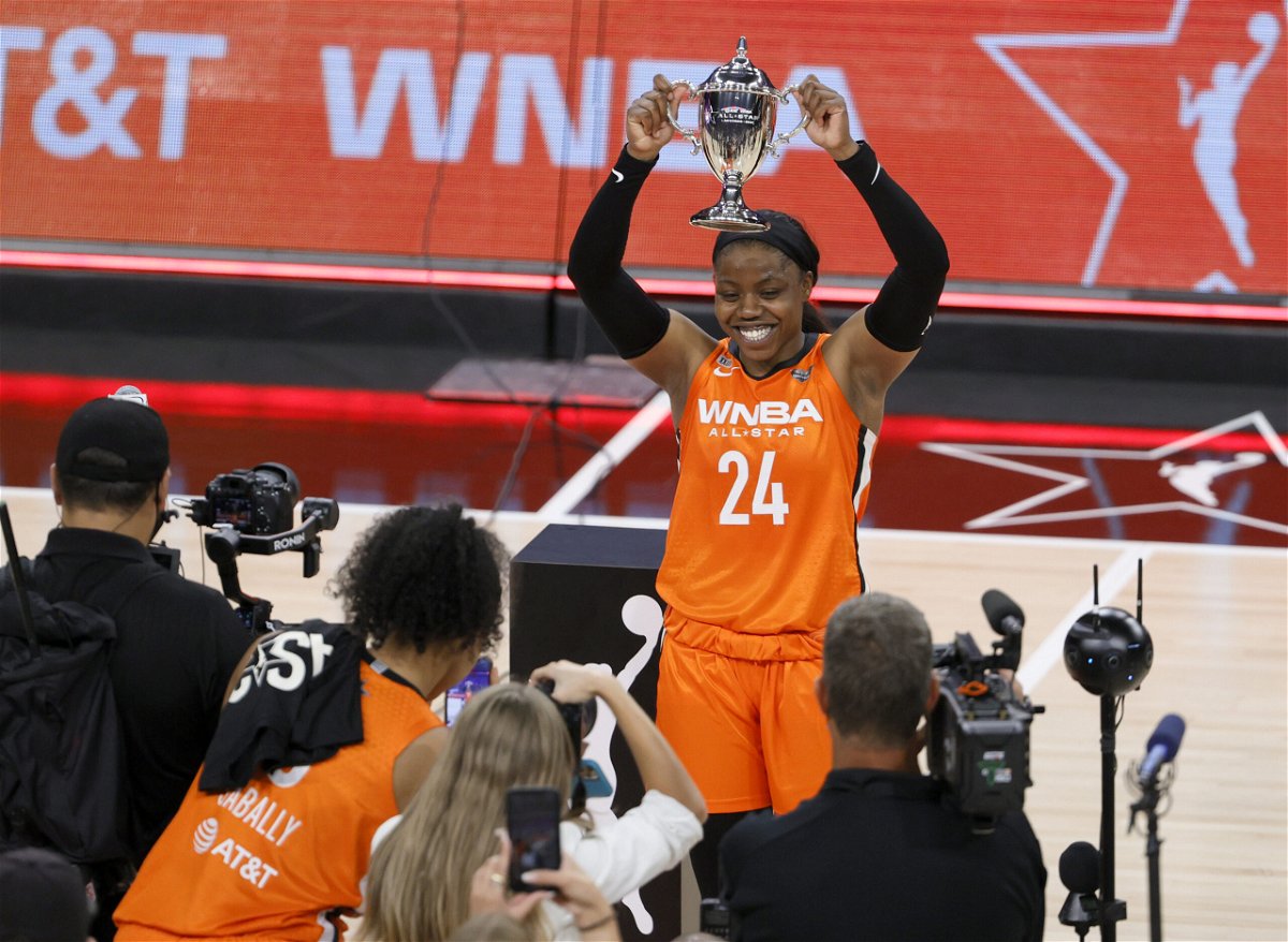 <i>Ethan Miller/Getty Images North America/Getty Images</i><br/>Arike Ogunbowale holds up the MVP trophy after dropping 26 points in the WNBA All-Star Game.