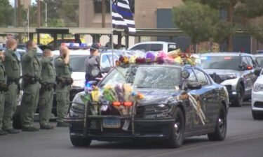 Members of law enforcement and the Las Vegas community honored a fallen Nevada Highway Patrol trooper as his body was moved