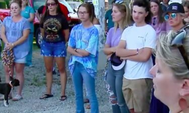 Family and friends prayed for healing as those close to three girls seriously injured in a crash earlier this week held a vigil in their honor.