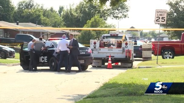 <i>KOCO</i><br/>Authorities survey the scene of a double homicide in Oklahoma City on August 7.