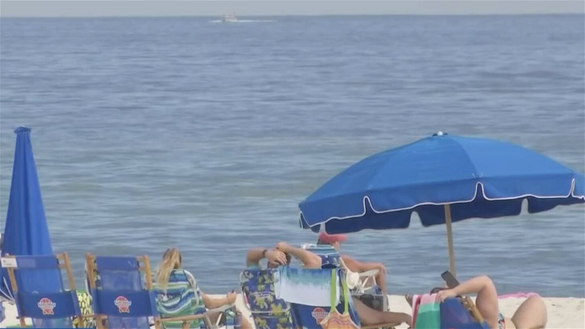 <i>WALA</i><br/>People relax at Gulf Shores in Alabama despite the threat of storm in the area.