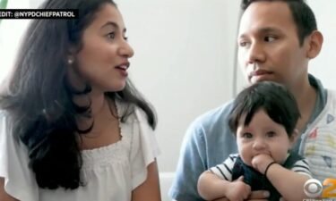 Raina Enand (left) sits with Sean Echevarria (right) and their 5-month-old son