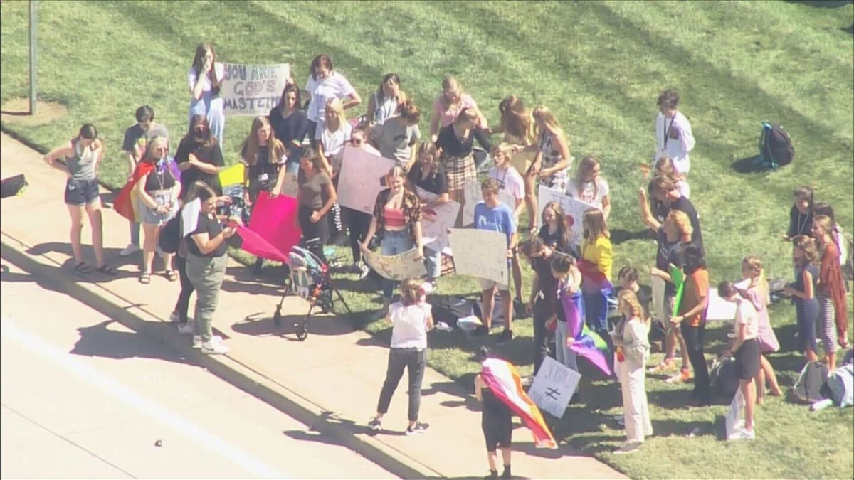 <i>KCNC</i><br/>About 30 students walked out of class on to support a coach who says he was forced to resign for being gay. They say they also want to see significant changes to the school's policies and culture.