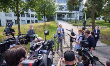 Seven people who ate at a university kitchen showed symptoms of poisoning on Monday. Chief Public Prosecutor Robert Hartmann (center) addresses journalists on Tuesday.