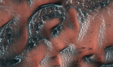 This image taken by the Mars Reconnaissance Orbiter shows a dusting of snow on the dunes of Mars' Northern hemisphere in 2017.