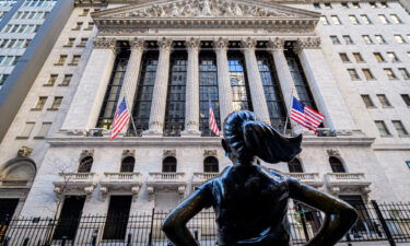 The 'Fearless Girl' statue is seen across the New York Stock Exchange on Wall Street.