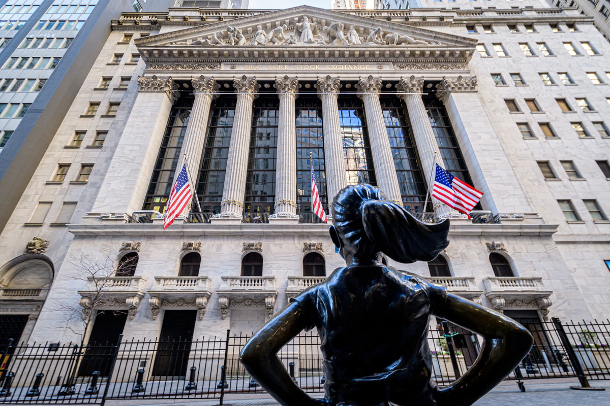<i>Erik McGregor/LightRocket/Getty Images</i><br/>The 'Fearless Girl' statue is seen across the New York Stock Exchange on Wall Street.