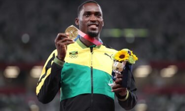 Hansle Parchment holds up his gold medal