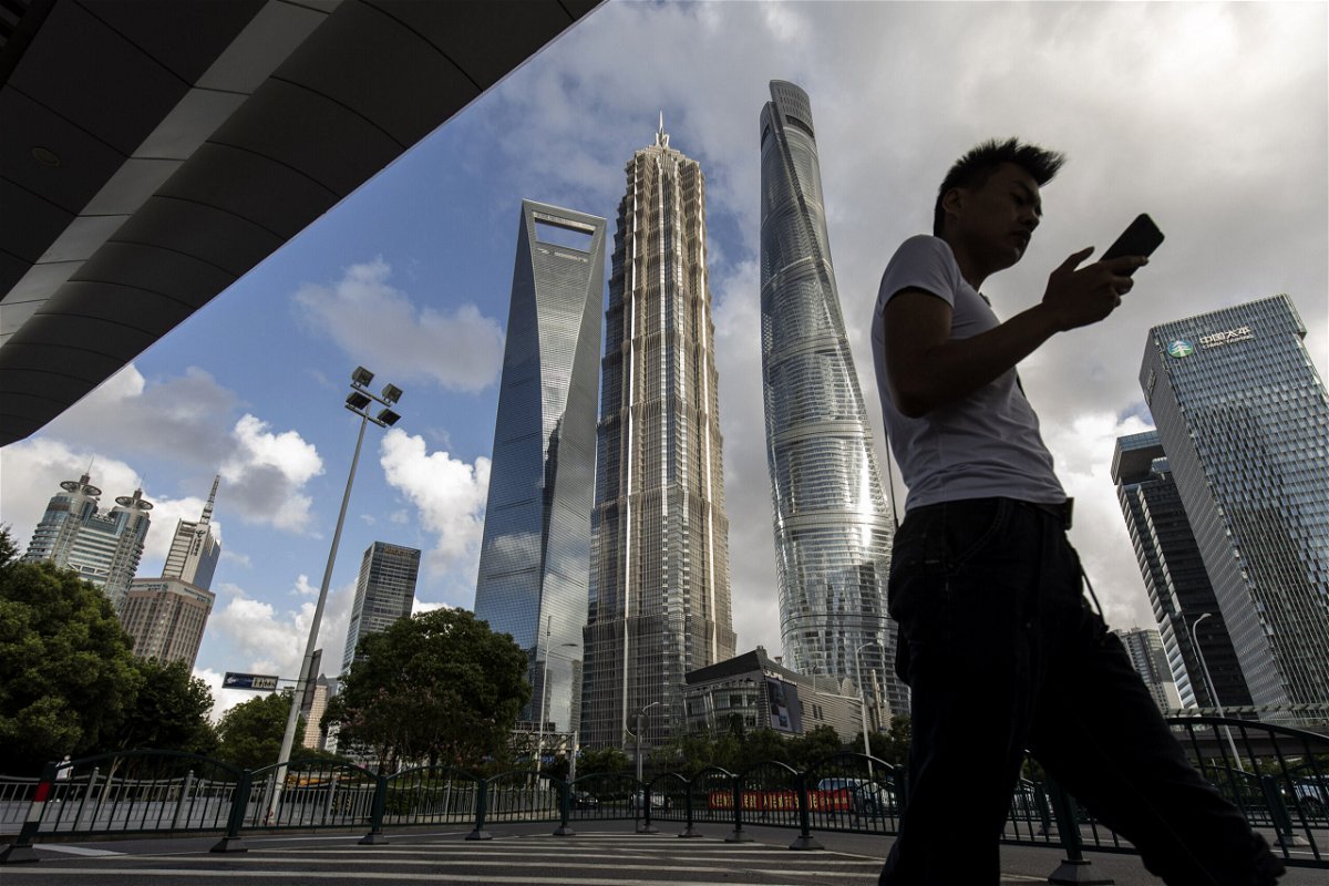 <i>Qilai Shen/Bloomberg/Getty Images</i><br/>Beijing toughens its regulation of the country's tech companies. A man here walks in Shanghai