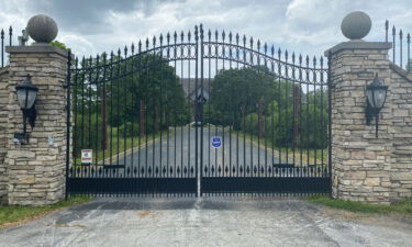 An undated photo provided by prosecutors shows the gates of R. Kelly's Olympia Fields house