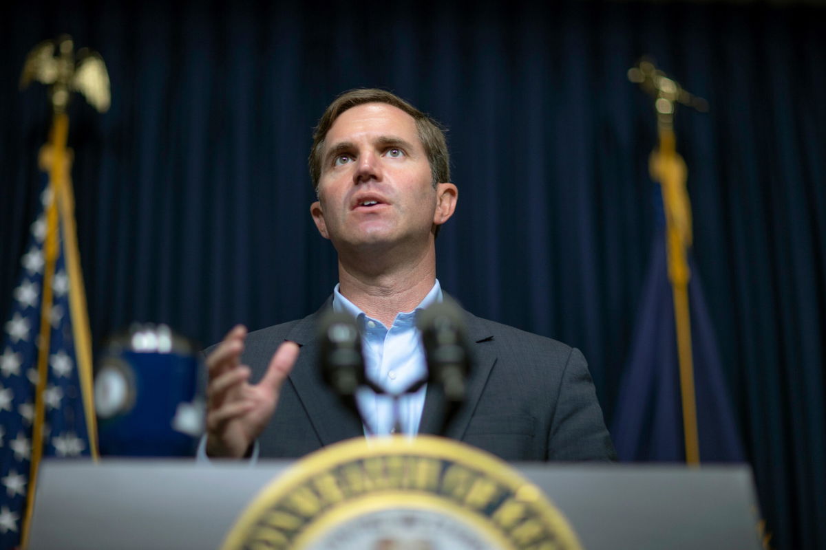 <i>Ryan C. Hermens/Lexington Herald-Leader/AP</i><br/>National Guard will be deployed across Kentucky to help overwhelmed hospitals. Kentucky Governor Andy Beshear here speaks during a media briefing in Frankfort