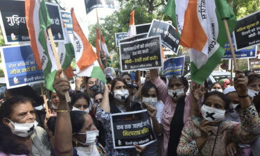 Protesters gather in New Delhi on August 3 to condemn the alleged rape and murder of a 9-year-old Dalit girl.