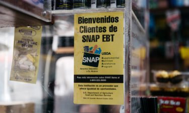 A sign alerting customers about SNAP food stamps benefits is displayed in a Brooklyn grocery store in New York City.