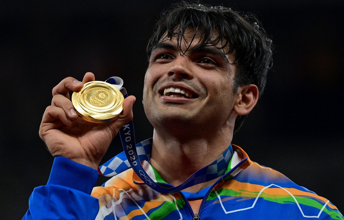 <i>Javier Soriano/AFP/Getty Images</i><br/>Gold medallist India's Neeraj Chopra celebrates on the podium during the victory ceremony for the men's javelin throw event during the Tokyo 2020 Olympic Games at the Olympic Stadium in Tokyo on August 7.