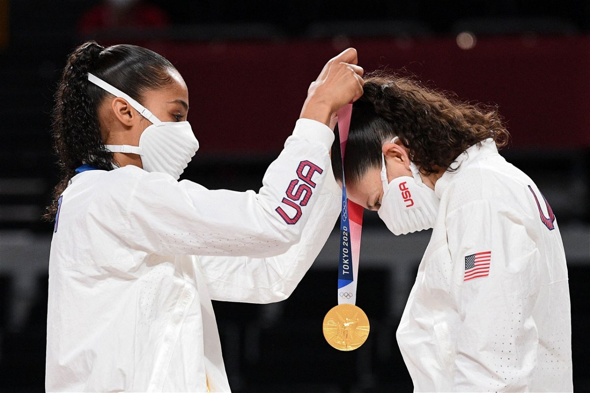 <i>Aris Messinis/AFP/Getty Images</i><br/>Team USA's Skylar Diggins (L) puts a gold medal on teammate Sue Bird during the medal ceremony for the women's basketball competition of the Tokyo 2020 Olympic Games on August 8.