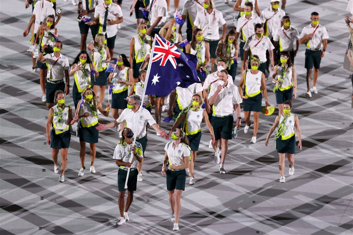 <i>Clive Brunskill/Getty Images</i><br/>Flag bearers Cate Campbell and Patty Mills of Team Australia lead their team in during the Opening Ceremony of the Tokyo 2020 Olympic Games at Olympic Stadium on July 23. Australian Olympic athletes returning from Tokyo to South Australia via Sydney will be forced to undergo a double quarantine of 28 days.