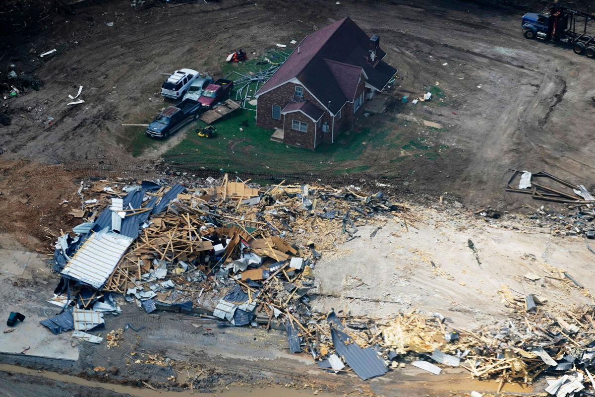 <i>Mark Humphrey/AP</i><br/>Search efforts have been suspended in Tennessee following deadly flooding Saturday. Damaged homes and cars are seen here Wednesday in Waverly