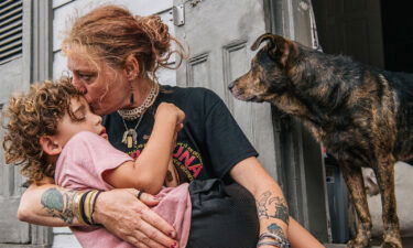 Ann Colette Boudreaux comforts her grandson Abel ahead of Hurricane Ida on August 29