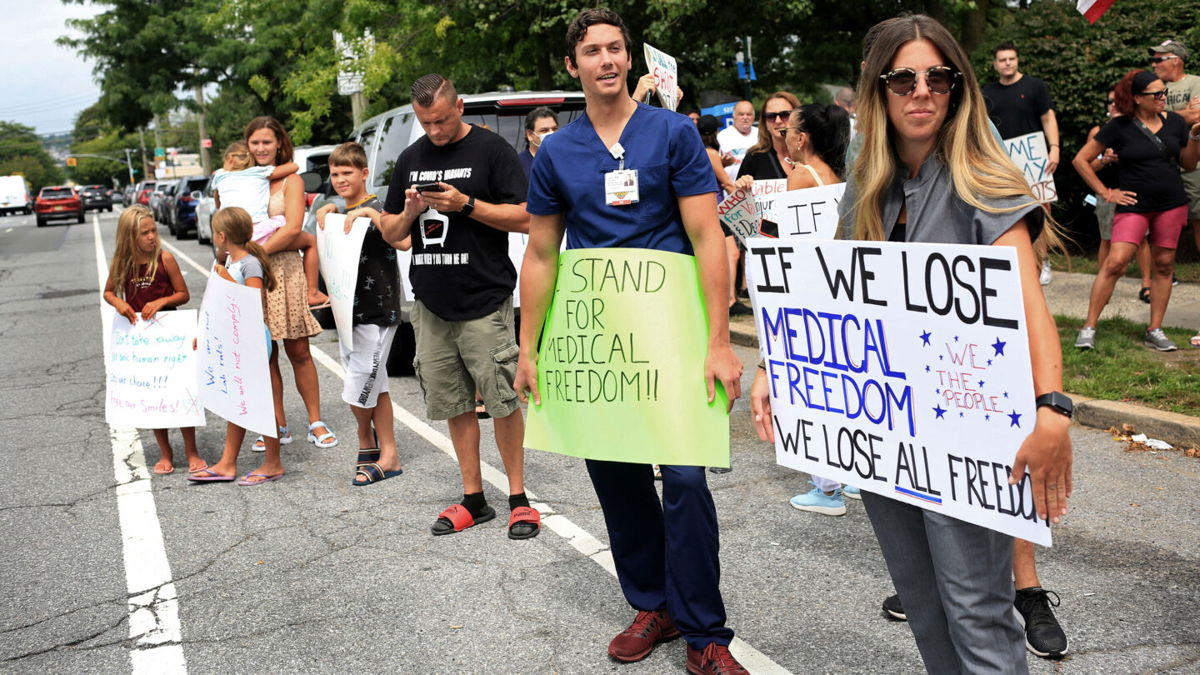 <i>Yana Paskova/The New York Times/Redux Pictures</i><br/>Staten Island University Hospital employees protested mandatory Covid-19 vaccination and testing outside the hospital last week.